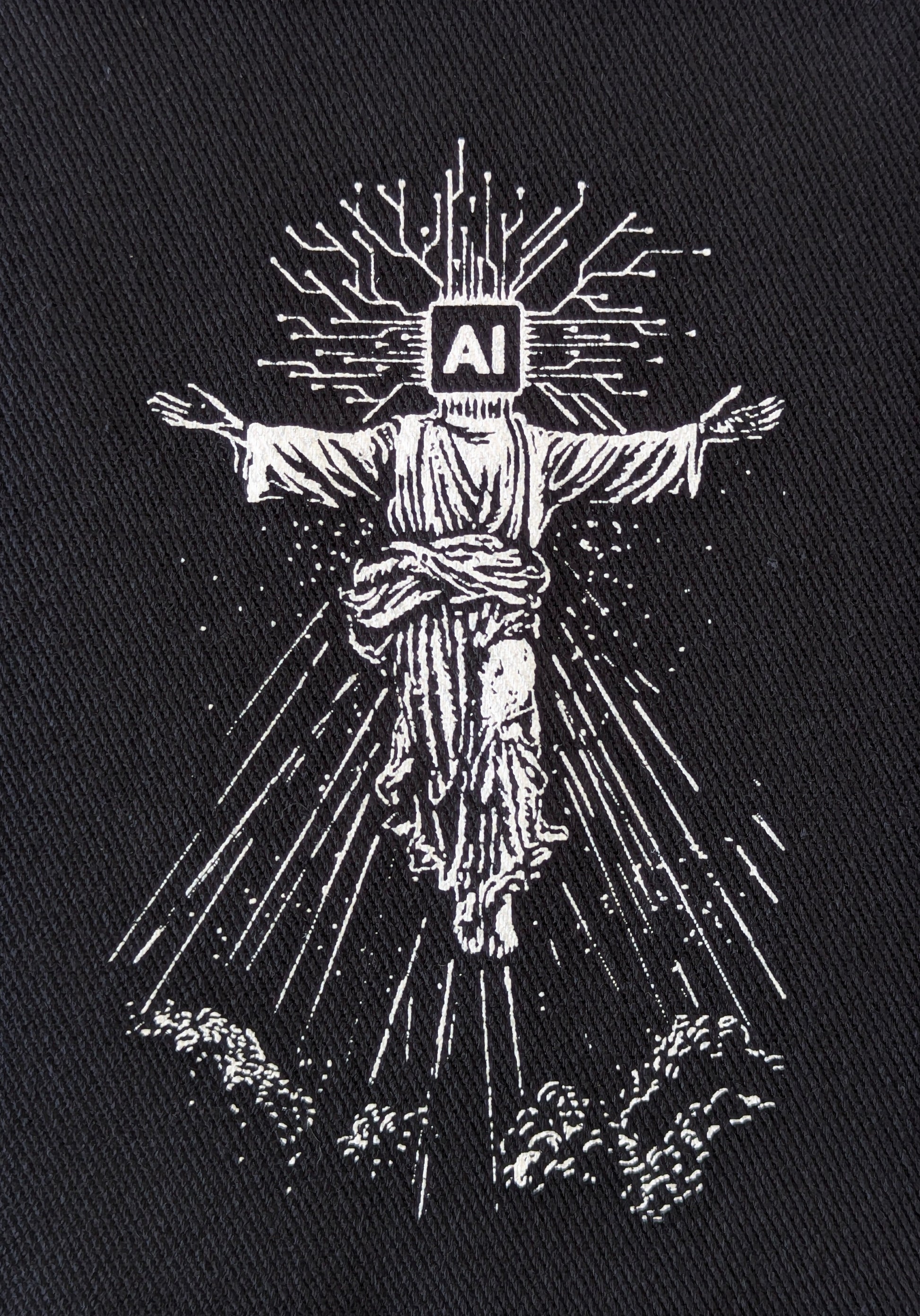 punk patch of a figure with 'AI' symbol on black fabric
